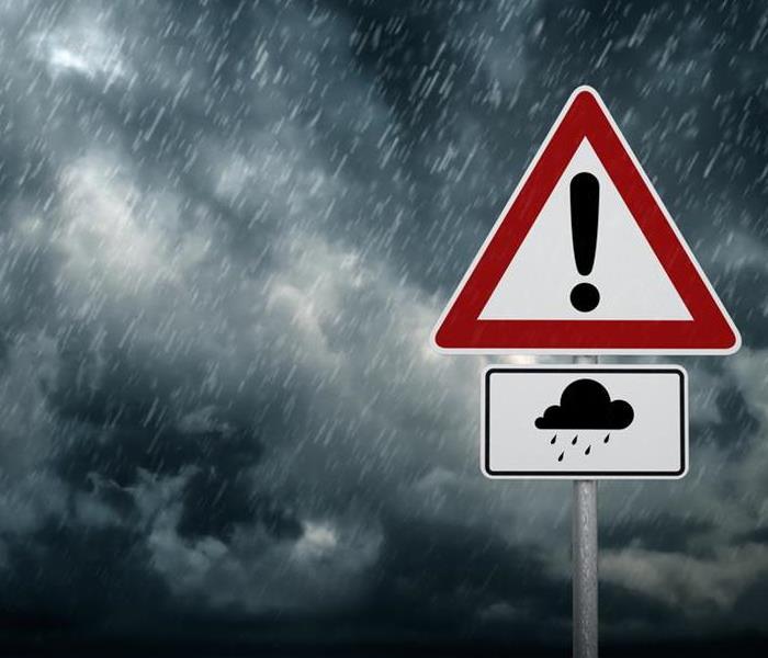 Image of cloudy sky with rain and street sign with cloud and rain icon