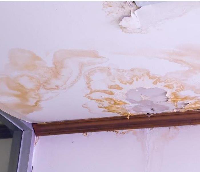 Discoloration on the ceiling indicating water damage